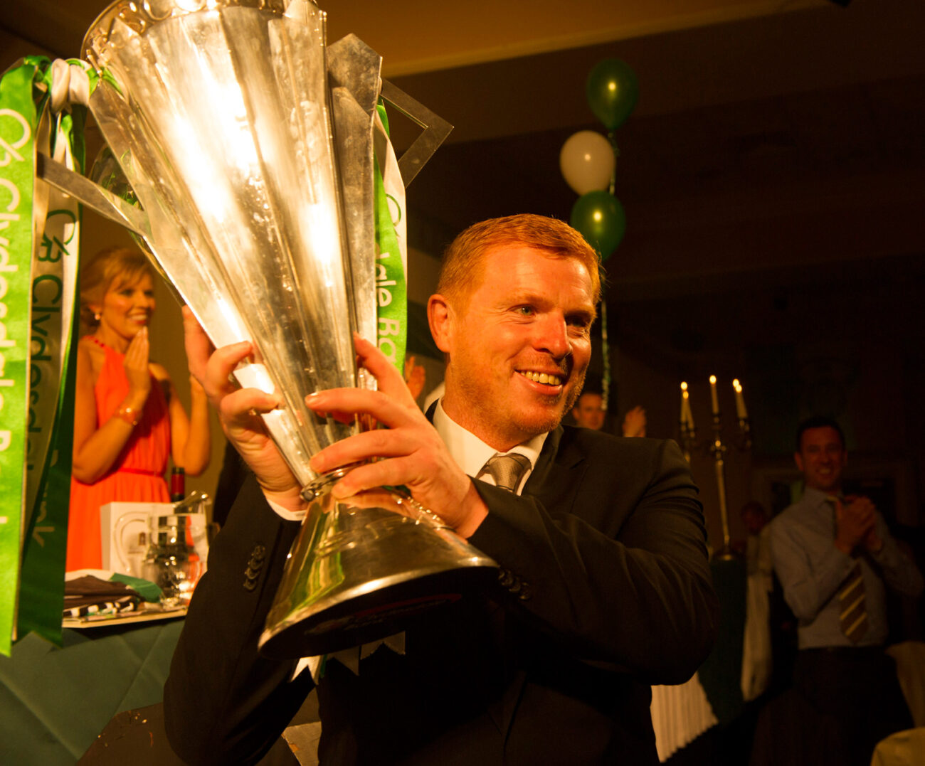 Celtic Manager Neil Lennon holds aloft the SPL Trophy at the 14th Annual AICSC Charity Dinner